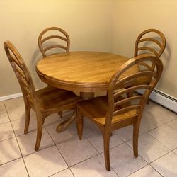 Solid oak pedestal dining table.