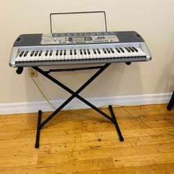 Casio LK-100 Keyboard. Vintage Antique. Key lighting system. 100 song bank. Never used. Like new condition. Excellent tool to help learning how to pla