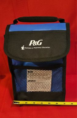 P&G (Procter & Gamble) insulated lunch bag/cooler. The bag has a handle and a mesh side pocket. 7"w×10"h×4"deep