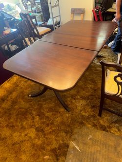 Mahogany Double Pedestal Extendable Dining Table and 6 matching chairs