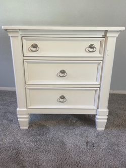 Three drawer white night stand