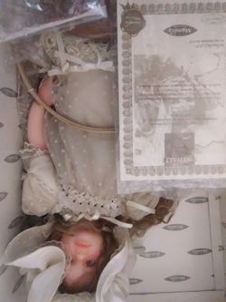 Large Mundia doll 23" in box with certificate like new with stand