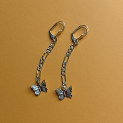 Gold tone chain dangling butterfly earrings