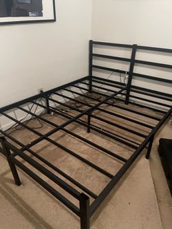 Black metal bed frame with matching headboard (no mattress)