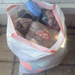 A Bag Full Of Yarn Balls And Some Thread 