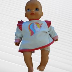 Baby doll 15" battery operated

Baby cries and cheeks turn red. Has Rip on pants as seen in pictures. Works. Great shape. Normal use