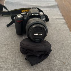 Nikon D3000 DSLR camera, which is an entry-level model. 
