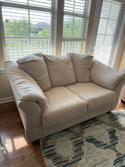 Two comfy loveseats in **great condition**.