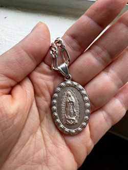 Virgin Mary pendant and chain.