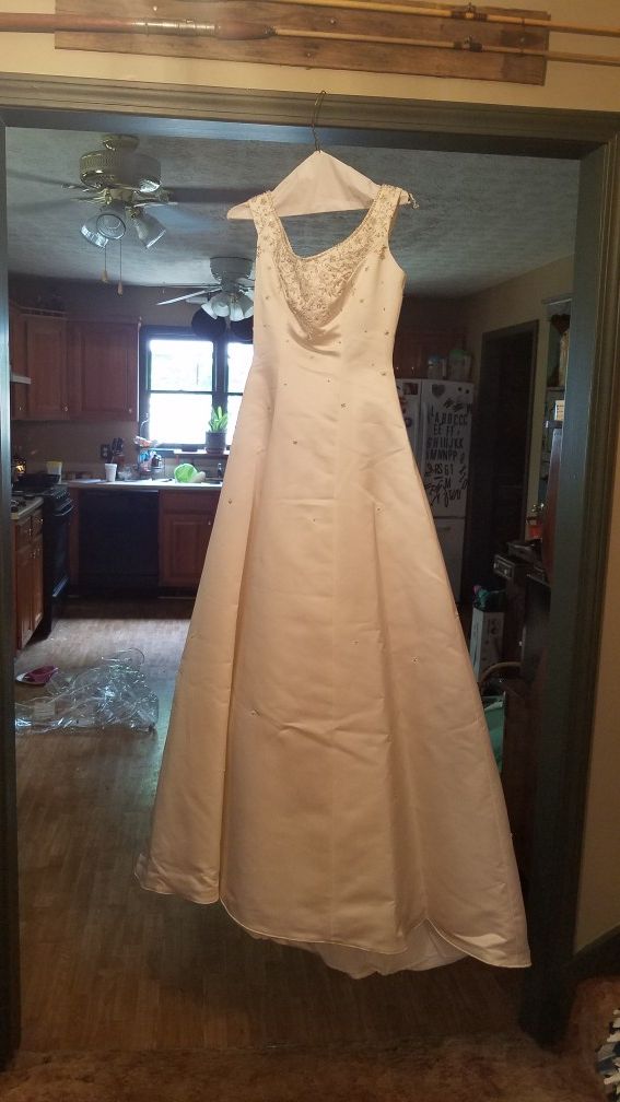 Wedding dress. We think J. Andrews collection