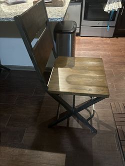 Two Ashley wooden chairs with metal frames