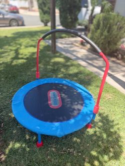 Little Tikes Easy Store 3' Trampoline with a blue jumping surface and red legs.