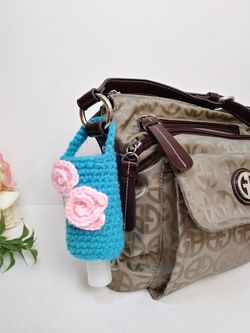 Amigurumi hand sanitizer holder. crochet hand sanitizer pouch. body lotion holder. bag charm. backpack hand sanitizer holder. gel disinfectant