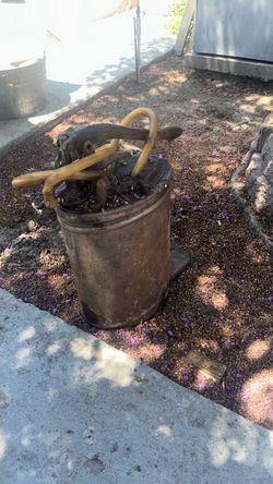 Antique copper automotive oil can with  pump