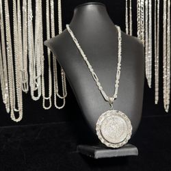 Italian silver diamond cut Milano chain with 1 ounce silver Aztec calendar coin and nugget bezel