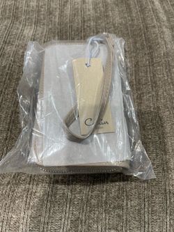 Small women’s clutch wallet. Color is Dark Stone