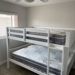 Full over Full bunk bed. Dark walnut,grey & white-$499. Full mattresses -$125.00 each. Assembly not included. Taxes included. Free delivery.  Se happy