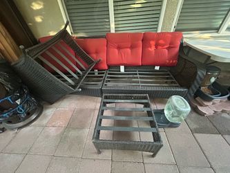 L-Shaped Outdoor Wicker Sectional Patio Set with Ottoman & Red Cushions