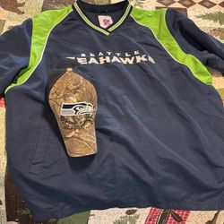 Seahawks Gear…. 1 Men’s XXL Nylon Pullover Plus 1 Mens Camo Cap
