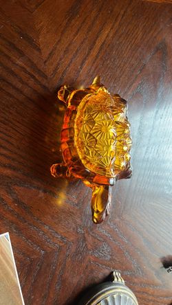 The selected item  is a vintage amber glass turtle or tortoise lidded candy dish, often attributed to L.G. Wright Glass Co. and frequently manufacture