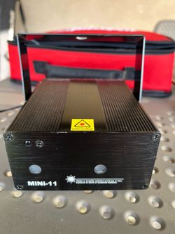 MiNi-11 laser stage projector with two output lenses for creating light patterns