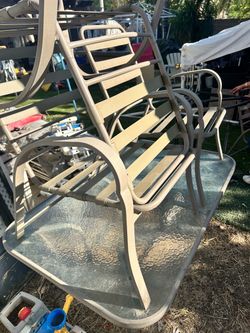 Backyard glass table and 4 chairs