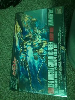 Gundam model still in box wrapped in plastic
