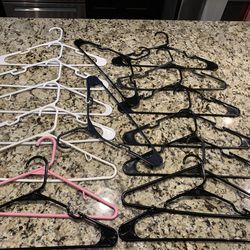 16 plastic clothes  Hangers, Some Have Special Hooks To Hold Strap Type Clothes. Various Colors