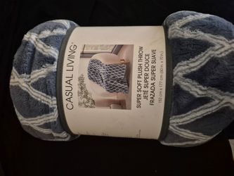 Brand new throw blanket never been used sill in its original packaging