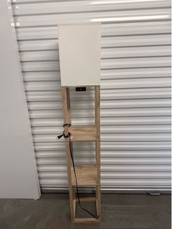 Floor length lamp with shelving