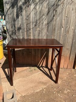 Bar height table it’s 36 inches tall 42 inches wide and 24 deep