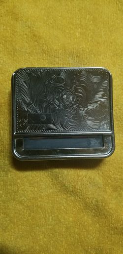 Cigarette roller & carrying tin