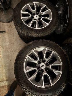 Stock Chevy 20” rims w/ tires 50% tread