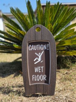 Surf board shaped wet floor sign