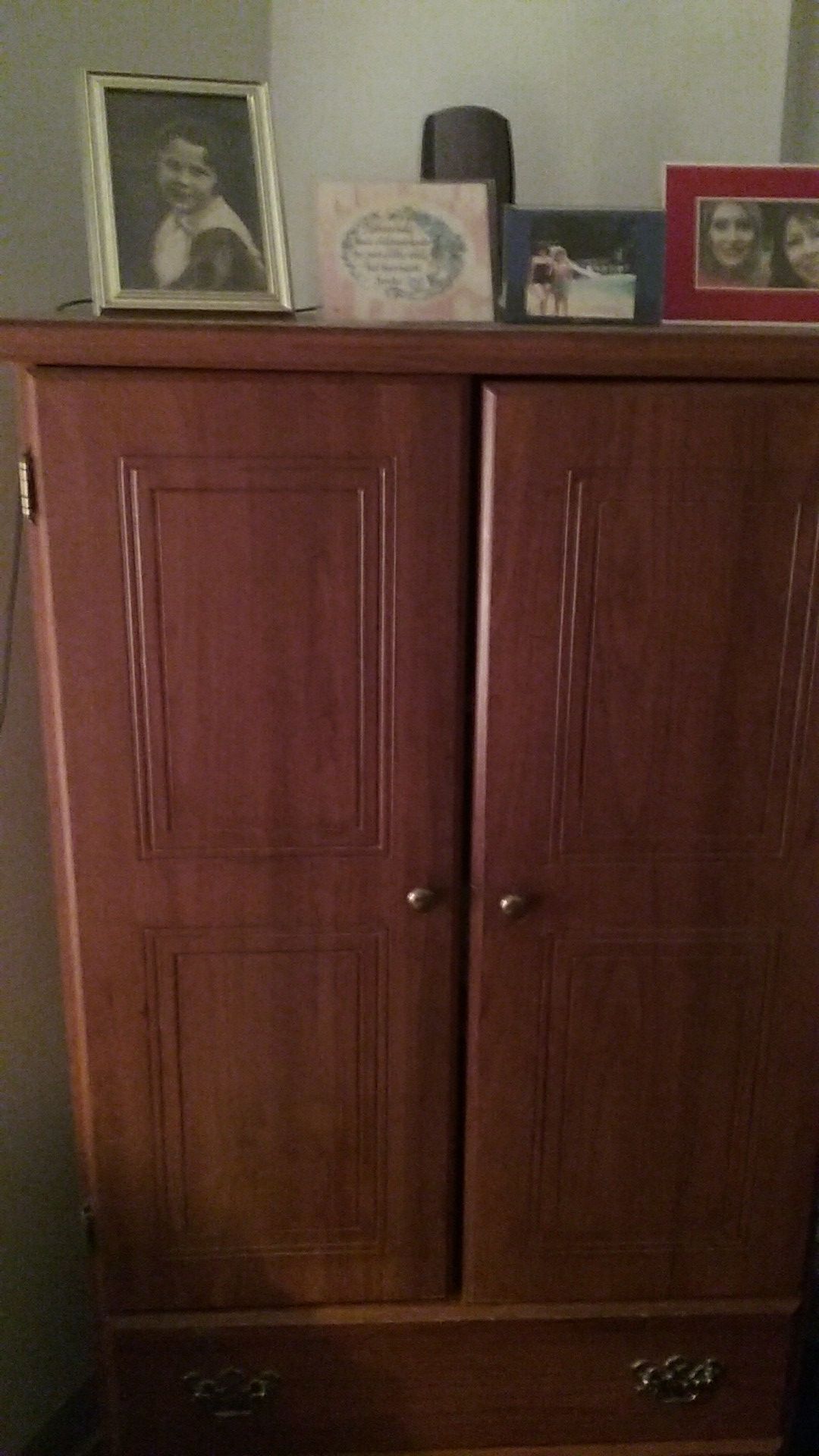2 door storage cabinet, 3 shelf space inside, two drawers below