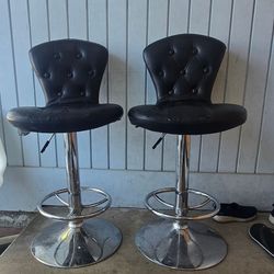 2 Black Bar Adjustable Swivel Stools Counter Height Faux Leather Chrome Base Footrest

Black tufted bar stools. Pair of two. Faux leather seats with c