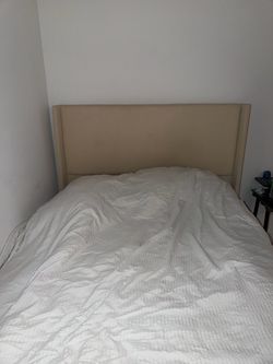 Beige Upholstered Wingback Headboard