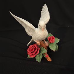 A Lenox fine porcelain Christmas Dove figurine with roses.