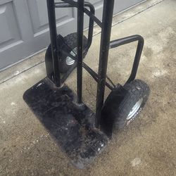 Hand truck with steel wheel covers and pneumatic tires