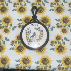 Mom's Kitchen cast iron tile Trivet 11"L x 7"W Robin bird & Wild Flowers. Only one rubber protector is left on back & it’s cracked - see pics 