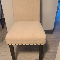 four black and beige chairs