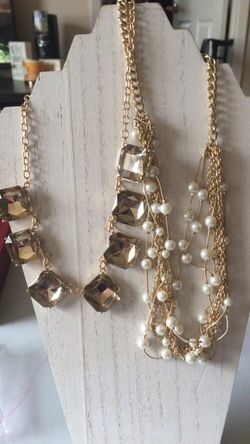 Two necklaces- 1 is 7 charming sisters-