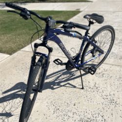 Blue Schwinn 21 speed bike.