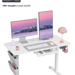 Electric standing desk BRAND NEW IN BOX still. Bought for $145, SELLING FOR $100 OBO.