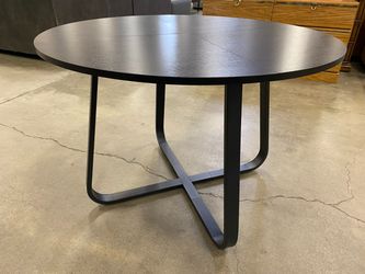 Round Black Dining Table with Crossed Metal Base