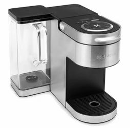 Brand new / closed box Keurig coffee maker and pod stand