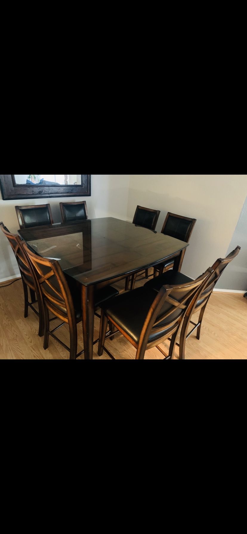 Dining table /8 chairs good condition with custom made thick glass top