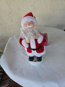 Beautiful  musical Santa candle  lights up 15 in.  Tall  in new condition