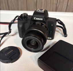 Canon EOS M50 Mark II with 15-45mm lens and battery and charger.