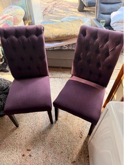Two deep purple eggplant statement chairs